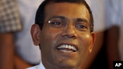 FILE - Mohamed Nasheed addresses the media at his residence in Male, Maldives, Sept. 8, 2013.