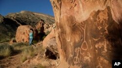 FILE - Petroglyphs are visible at the Gold Butte National Monument near Bunkerville, Nev., May 26, 2017. The monument is along the Arizona border in Southern Nevada.