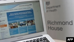 This photograph, posed as an illustration on May 12, 2017, shows the website of the NHS: East and North Hertfordshire notifying users of a problem in its network taken outside the Department of Health in London. 