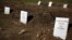Tombstones are placed on graves of unidentified refugees and migrants who drowned at sea during an attempt to cross a part of the Aegean Sea from the Turkish coast, at a cemetery near the village Kato Tritos on the Greek island of Lesbos, Feb. 6, 2016. 