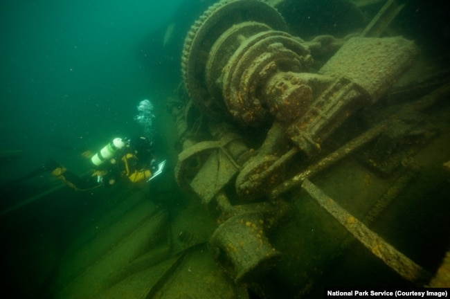 A diver explores a shipwreck at Isle Royale National Park