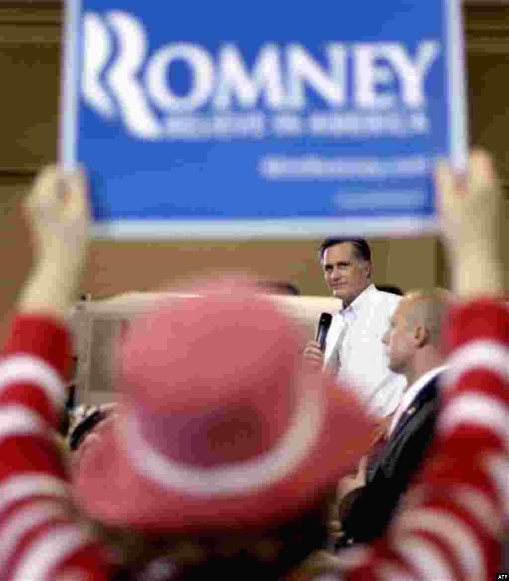 Republican presidential candidate, former Massachusetts Gov. Mitt Romney looks toward a supporter while speaking during a campaign rally, Friday, Jan. 20, 2012, in North Charleston, S.C. (AP Photo/David Goldman)