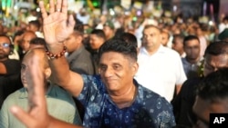 Presidential candidate and opposition leader Sajith Premadasa of the Samagi Jana Balawgaya or United People's Power party waves to supporters as he arrives for the final election rally in Colombo, Sri Lanka, Sept. 18, 2024.