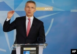 NATO Secretary General Jens Stoltenberg speaks during a media conference at NATO headquarters in Brussels on March 27, 2018.