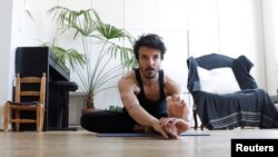 Dancer and choreographer Nicolas Maloufi practices yoga during the outbreak of the coronavirus disease (COVID-19) in Paris, May 6, 2020. 