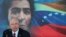FILE - In this Oct. 10, 2014 file photo, Venezuela's then Foreign Minister Rafael Ramirez gives a press conference backdropped by an image of independence hero Simon Bolivar, in Caracas, Venezuela.