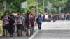 Migrants walk through Tapachula, Chiapas state, Mexico, Nov. 20, 2024, hoping to reach the U.S. border.