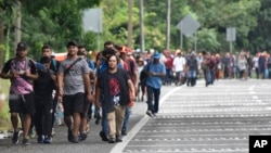 Migrants walk through Tapachula, Chiapas state, Mexico, Nov. 20, 2024, hoping to reach the U.S. border.