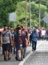 Migrants walk through Tapachula, Chiapas state, Mexico, Nov. 20, 2024, hoping to reach the U.S. border.