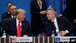 U.S. President Donald Trump and NATO Secretary General Jens Stoltenberg participate in a round table meeting during a NATO leaders meeting, Dec. 4, 2019.