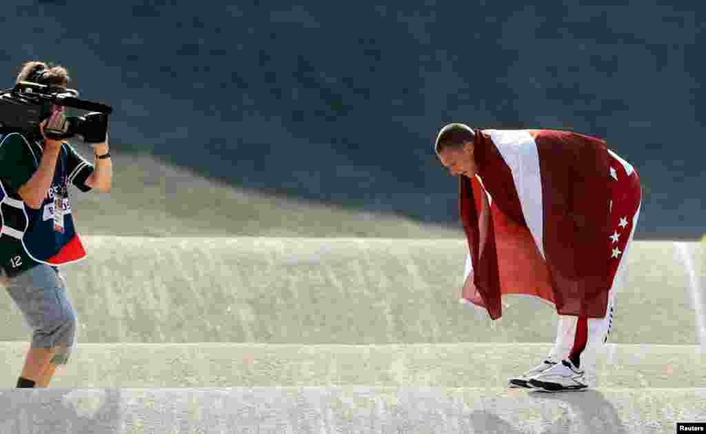 Latvia's Maris Strombergs bows after winning the men's BMX event.
