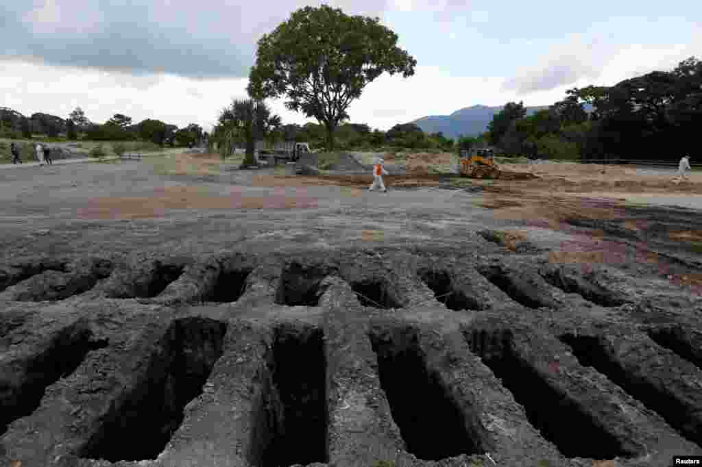 Recently dug graves are seen at an area for victims of the coronavirus disease (COVID-19) at La Bermeja cemetery, as the coronavirus disease outbreak continues in San Salvador, El Salvador, July 21, 2020.