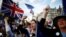 Anti-Brexit protesters demonstrate outside the Houses of Parliament in London, Sept. 4, 2019.