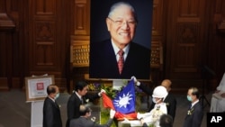 A Taiwanese flag is laid during a memorial service for the late former Taiwanese President Lee Teng-hui in Taipei, Taiwan, on Sept. 19, 2020. 