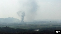 A captured image from a thermal observation device shows the explosion of an inter-Korean liaison office in North Korea's Kaesong Industrial Complex, as seen from a South Korean observation post in Paju on June 16, 2020. - North Korea blew up an inter-Kor