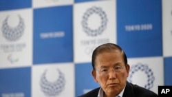 FILE - Toshiro Muto, CEO of the 2020 Tokyo Olympics organizing committee, listens to questions from the media during a news conference in Tokyo, June 11, 2019.