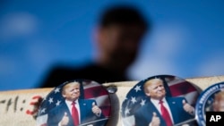 A vendor sells Donald Trump buttons in Washington on Jan. 18, 2017, ahead of Friday's inauguration.