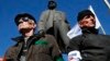 Activists stand guard during a pro-Russian rally at a central square in Donetsk, eastern Ukraine, March 23, 2014.