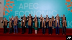 (FILE) President Joe Biden and other APEC leaders as they pose for a family photograph at the APEC Summit in Lima, Peru on Saturday, Nov. 16, 2024.