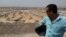 Slain Iraq cameraman Yasser Faysal al-Joumaili pictured overlooking Kawergosk refugee camp in Northern Iraq, September 2013. (Imran Khan/Al Jazeera English)
