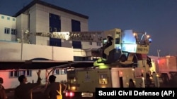 Firefighters respond to a fire at a hospital in Jizan, Saudi Arabia, Dec. 24, 2015. 
