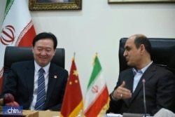 Chinese Ambassador to Iran Chang Hua, left, meets the governor of Iran's Golestan province Hadi Haqshenas on a visit to Golestan in November 2019 (Credit: Iranian tourism ministry)