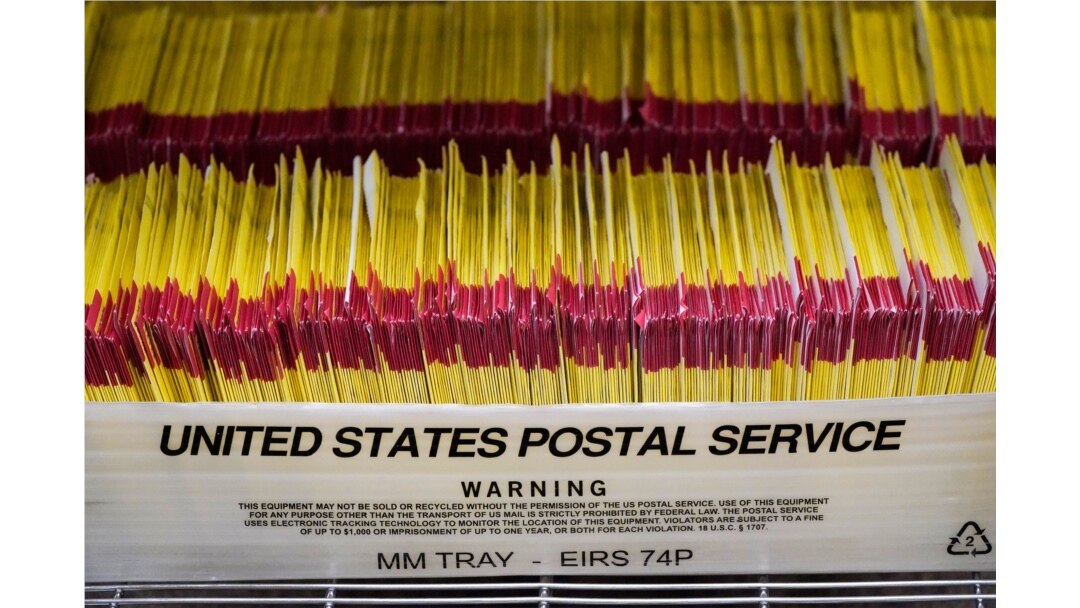 FILE - Returned ballots are shown at elections management center at the Salt Lake County Government Center Wednesday, Oct. 21, 2020, in Salt Lake City.