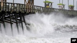 Waves from Hurricane Florence pound the Bogue Inlet Pier in Emerald Isle, N.C., Sept. 13, 2018.