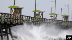 Waves from Hurricane Florence pound the Bogue Inlet Pier in Emerald Isle, N.C., Sept. 13, 2018.