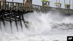 Waves from Hurricane Florence pound the Bogue Inlet Pier in Emerald Isle, N.C., Sept. 13, 2018.