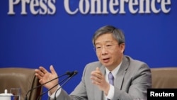 中國人民銀行行長易綱2019年3月10日在北京人大會堂舉行的全國人大記者會上。