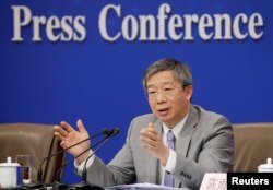 中国人民银行行长易纲2019年3月10日在北京人大会堂举行的全国人大记者会上。
