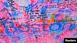 Messages at a memorial for the victims of the Boston Marathon bombings are seen in Boston, Massachusetts, April 25, 2013.