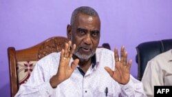 FILE - Seif Sharif Hamad, the leader of the opposition, gives a press conference at The Alliance for Change and Transparency (ACT) head office in Stone Town, Zanzibar, Oct. 27, 2020.