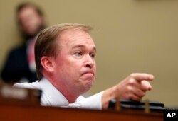 FILE - Rep. Mick Mulvaney, R-S.C., questions Mylan CEO Heather Bresch on Capitol Hill in Washington, Wednesday, Sept. 21, 2016, as she testifies before the House Oversight Committee hearing on EpiPen price increases.