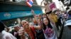 Anti-government protesters cheer during a march through Bangkok, Thailand, Feb. 3, 2014. 