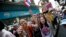 Anti-government protesters cheer during a march through Bangkok, Thailand, Feb. 3, 2014. 