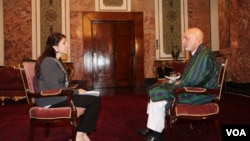 VOA Pashto host Shaista Sadat conducts an exclusive interview with President Hamid Karzai at the Presidential Palace in Kabul, July 14, 2014. 