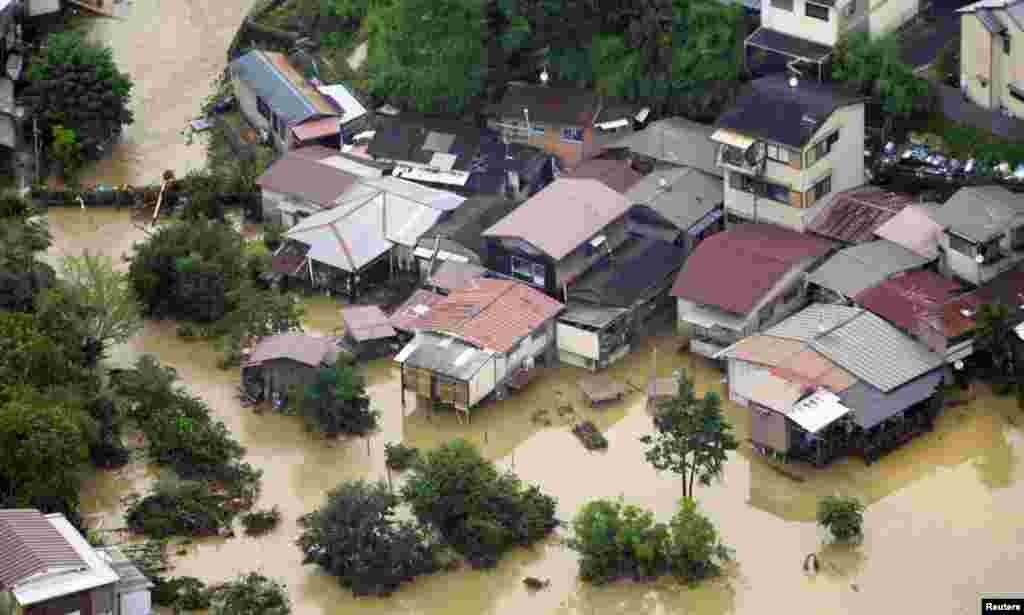 An aerial view shows a flooded residential area in Kyoto.