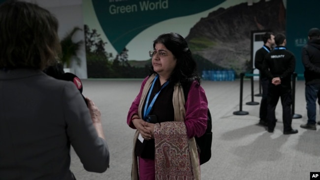 Chandni Raina, part of India's negotiating team, speaks to members of the media outside a closing plenary session at the COP29 U.N. Climate Summit in Baku, Azerbaijan, Nov. 24, 2024.