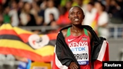 FILE: World Athletics Championships - Doha 2019 - Men's 10,000 Meters Final October 6, 2019 Kenya's Rhonex Kipruto celebrates winning bronze at the event.