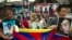 Exile Tibetans carry portraits of Tibetans who have immolated themselves in Tibet protesting Chinese rule, during a street protest in Dharmsala, India, Aug.29, 2012. 