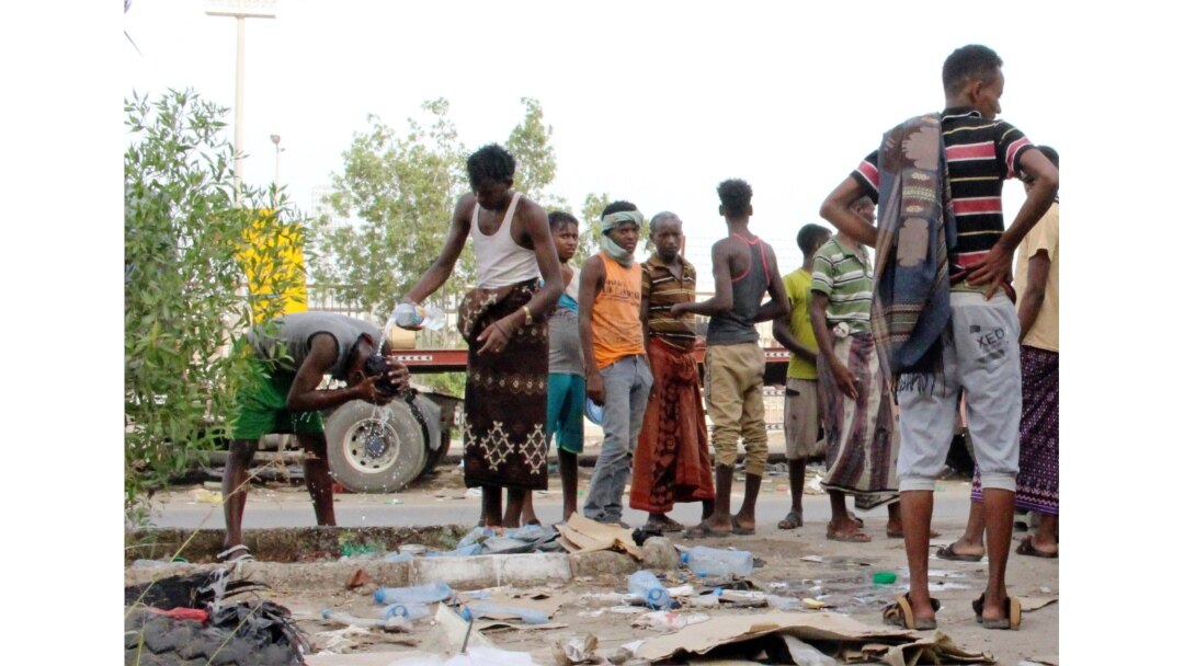 Ethiopian migrants gather on a pavement where they sleep in Aden, Yemen, June 15, 2020.