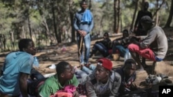 Sub-Saharan migrants aiming to cross to Europe take shelter in a forest overlooking the neighborhood of Masnana, on the outskirts of Tangier, Morocco, Sept. 5, 2018.