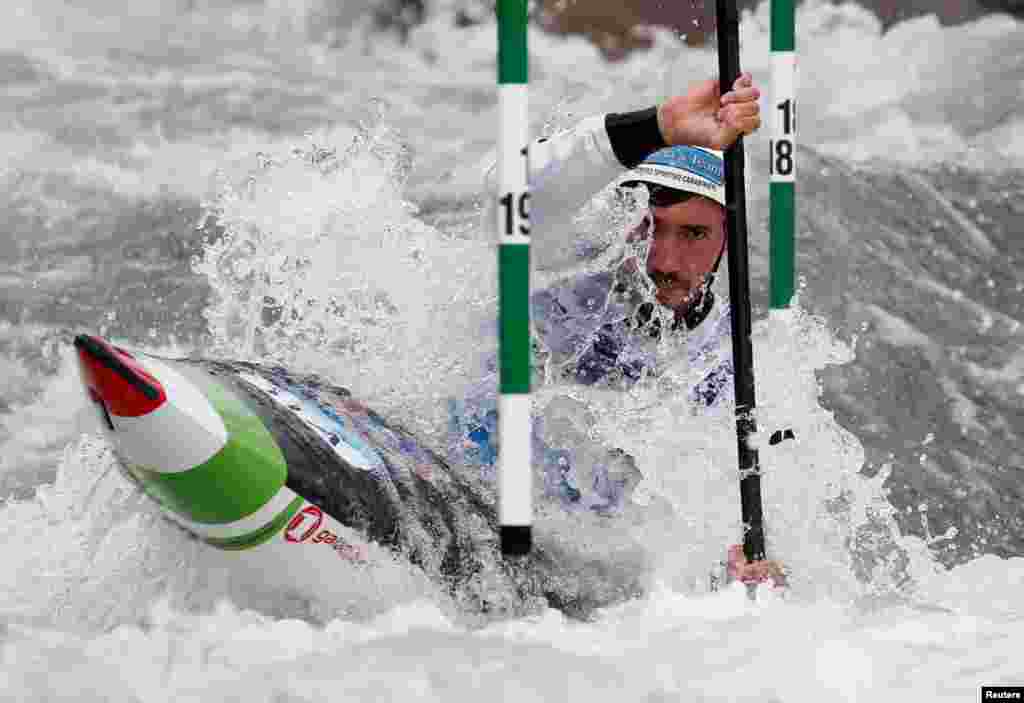 Italy's Giovanni De Gennaro competes during the Men's Kayak (K1) final of 2021 Canoe Slalom European Championships in Ivrea, Italy, May 8, 2021.