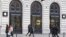 FILE - In this Jan. 1, 2013 file photo, Parisians and tourists wander in front of an Apple store in Paris. A French prosecutor office said Jan. 9, 2018 an investigation into Apple over alleged planned obsolescence of some of its smartphones has been opened.