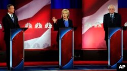 From left, Democratic presidential candidates Martin O'Malley, Hillary Clinton and Bernie Sanders participate in the NBC, YouTube Democratic presidential debate at the Gaillard Center, in Charleston, S.C., Jan. 17, 2016.