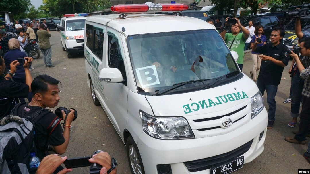 In this photo taken by Antara Foto, ambulances carrying coffins make their way to Nusa Kambangan prison at Wijayapura quay, Cilacap, Central Java, Indonesia, Jan. 17, 2015.