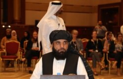 FILE - Taliban spokesman Suhail Shaheen is seen during talks in the Qatari capital Doha, July 7, 2019.
