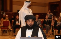FILE - Taliban spokesman Suhail Shaheen is seen during talks in the Qatari capital Doha, July 7, 2019.